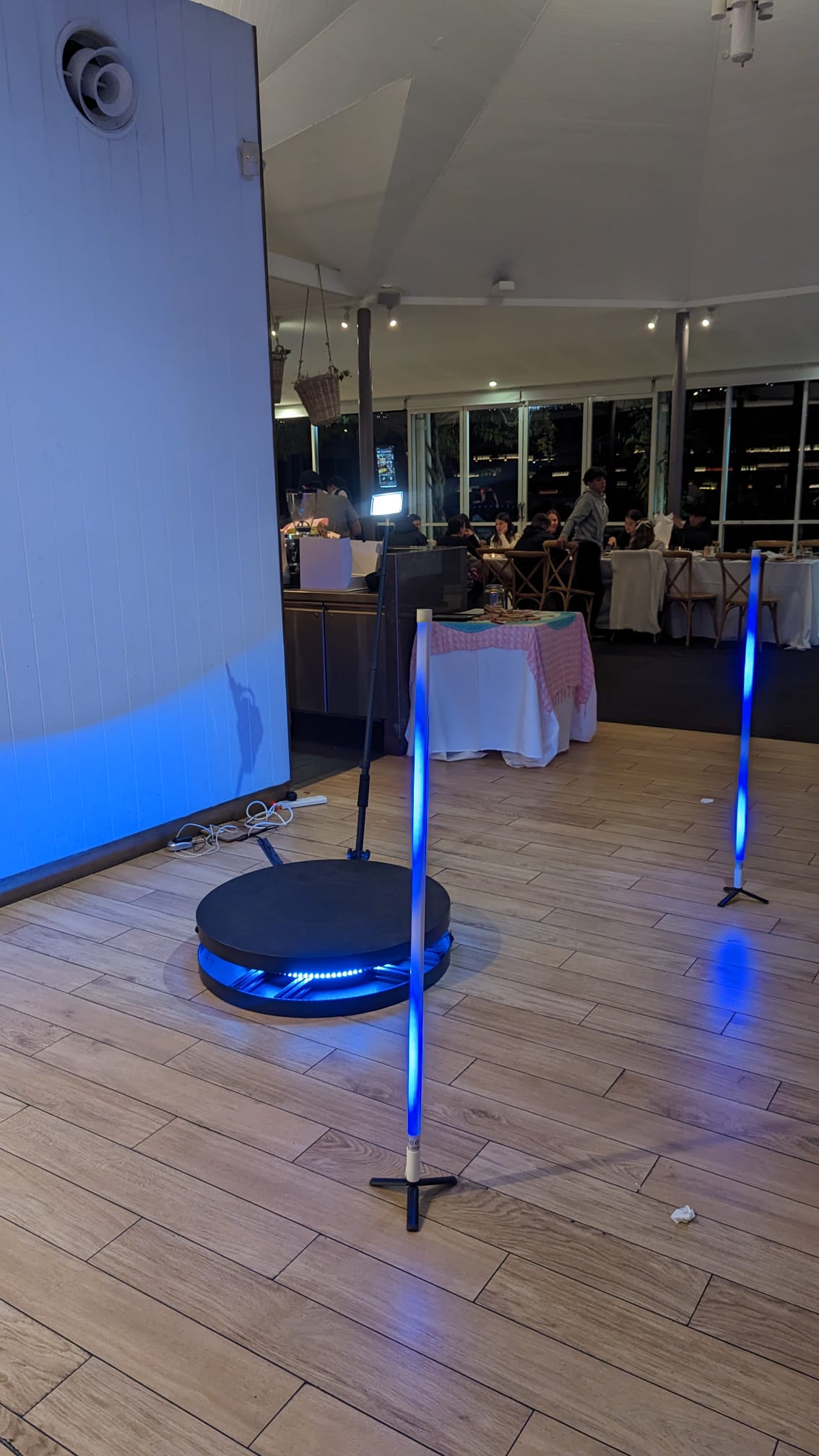 360 photo booth with blue LED glow tubes set up at a Sydney reception venue